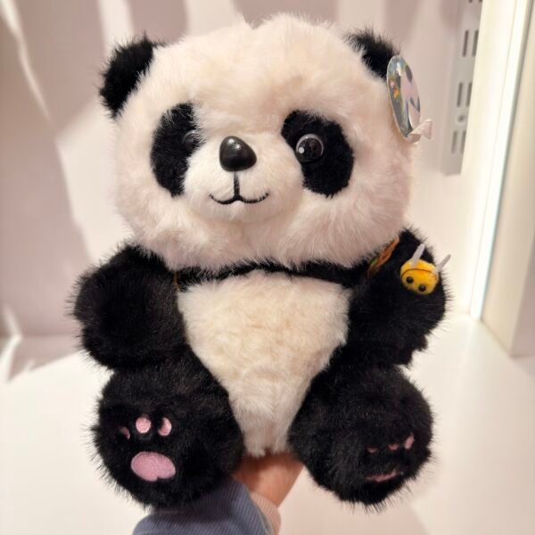 Peluche panda con mochila de manzana