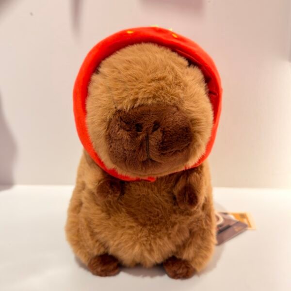 Peluche de capybara capucha fresa