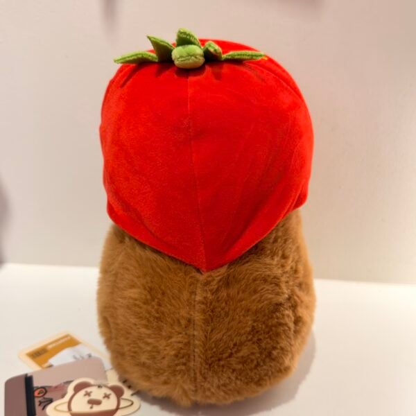 Peluche de capybara capucha fresa